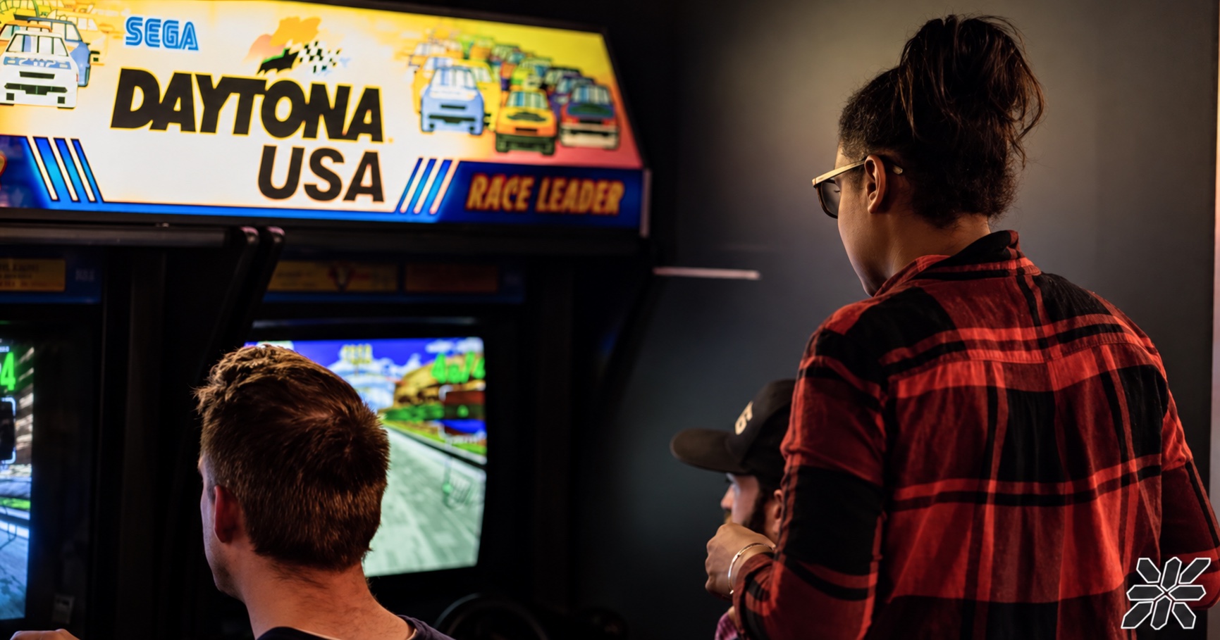 Guests playing Daytona USA together at ZED*80